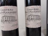 three bottles of wine that are sitting on a table