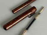three different types of pipe holders on a table