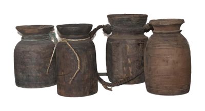 four vases that are sitting next to each other