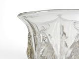 a glass vase that is sitting on a table
