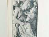 an open book with a drawing of a woman holding a baby
