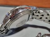 a close up of a watch on a table