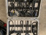 two cases with wires and cords in them on the floor