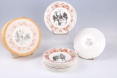 several plates with different designs and designs on them sitting on a table