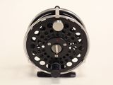 an image of a close up of a fly reel on a white background