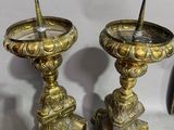 two candles that are sitting next to each other on a table
