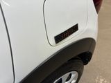 a close up of a white truck with a sticker on it