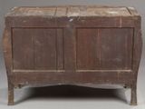 an old wooden chest with two doors on top of it