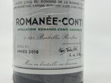 a bottle of wine that is sitting on a table