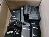a cardboard box filled with lots of electronic equipment