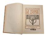 an open book with a picture of a tree on it