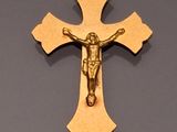 gold plated crucift with jesus on the cross hanging from a chain
