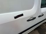 a white van that has a sticker on the side of it