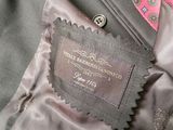 a close up of a suit and tie with a label on it