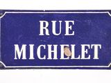 blue and white street sign with the words rue michelet on it