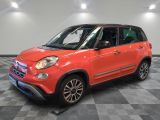 a red fiat car is parked in a room with a checkered floor