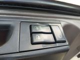 a close up of a car ' s interior with the control buttons on