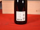 a bottle of wine that is sitting on a table