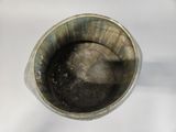 a close up of a cup with a liquid inside of it