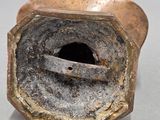 a close up of a metal object with a hole in it