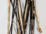 a lot of sticks that are hanging on the wall