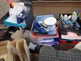 a desk with a lot of office supplies on it