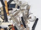 a pile of assorted electronic components on a white surface