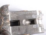 a metal object that is sitting on a white surface