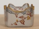 a close up of a silver and gold bracelet on a table