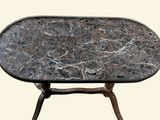 a table with a marble top on a stand