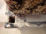 a couch with a hole in the middle of it