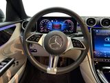 the interior of a car with a steering wheel and dashboard controls