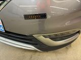 a close up of a car ' s bumper with a sticker on it