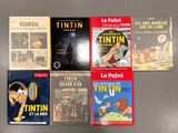 Plusieurs livres sont alignés sur une table.