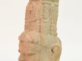 sculpture of a woman ' s head on a white surface with a white background