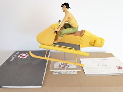 a figurine of a man riding on a yellow plane