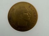 an image of a gold coin with a man ' s face on it