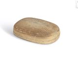a small wooden object that is sitting on a white surface