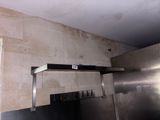 a picture of a kitchen with a stainless steel stove