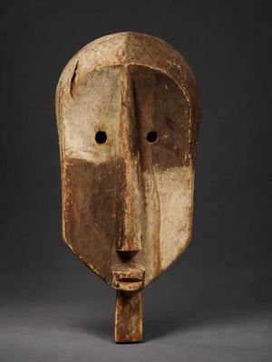 a wooden mask with a face made out of wood
