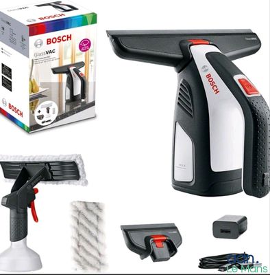 a black and white vacuum cleaner and a box of cleaning supplies