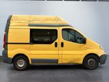 the yellow van is parked in the garage with the door open