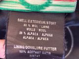 an image of a person holding a label on a dress