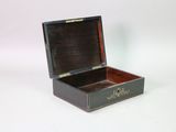 a small wooden box that is open on a white surface