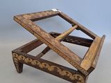 an image of a wooden table with a glass top on a white surface