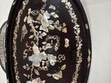 a picture of a decorative oval tray with flowers and birds on it