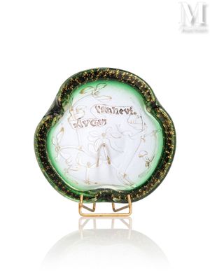 an image of a green and white plate with a picture of a woman on it