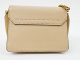 a beige leather cross body bag with a chain strap