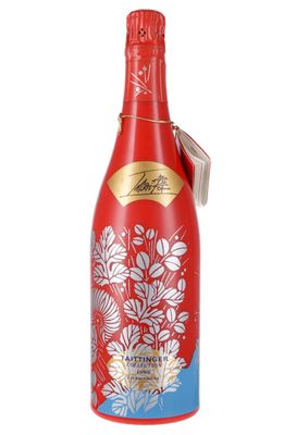 a bottle of red wine with a floral design on it