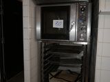 a metal oven that is in the middle of a room